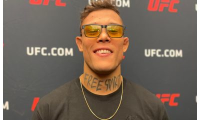 De óculos e cordão amarelo, Caio Borralho conversa com a imprensa no media day do UFC Vegas 72