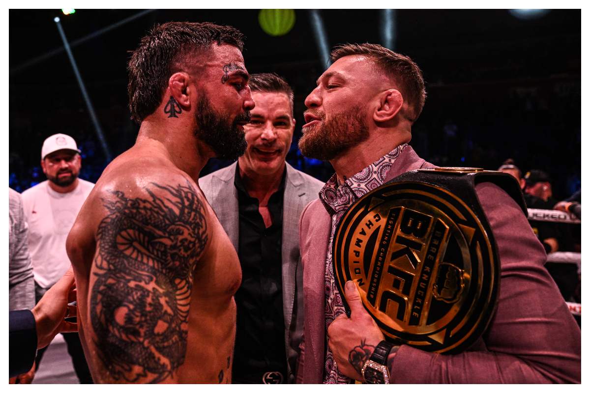Com o cinturão do evento de boxe sem luvas no ombro, McGregor faz encarada com Mike Perry