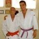 Joaquim Valente, ainda como faixa-roxa, ao lado do grão-mestre Hélio Gracie.