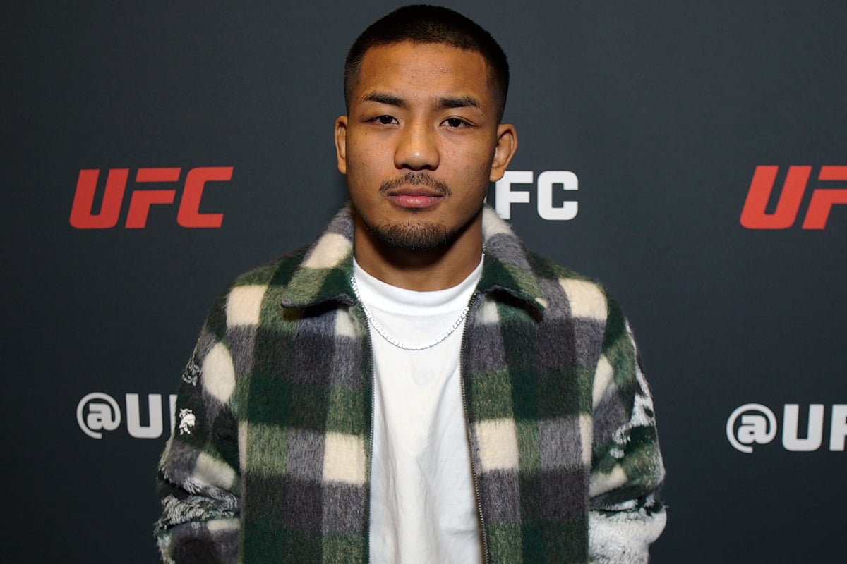 Joshua Van posa para foto no media day do UFC 323