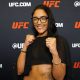 Sorridente, Alice Pereira posa para foto no media day do UFC Vegas 115
